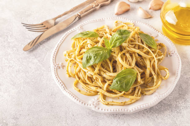 istock Pasta with homemade pesto sauce. 919577508