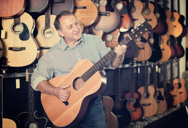 istock Man playing on acoustic guitar 919580632