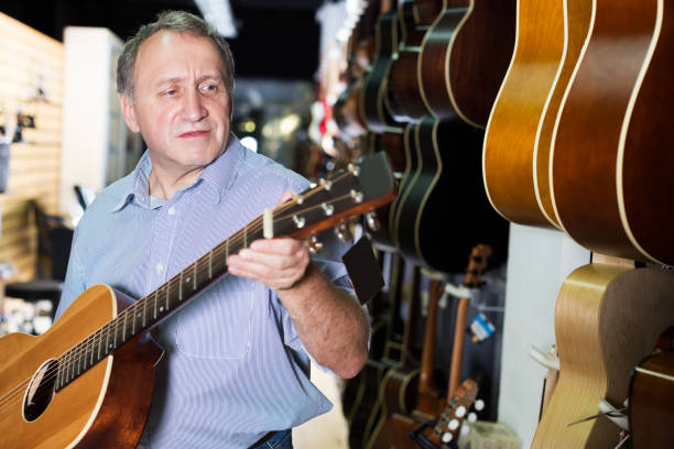 istock male is standing with modern guitar 919580656