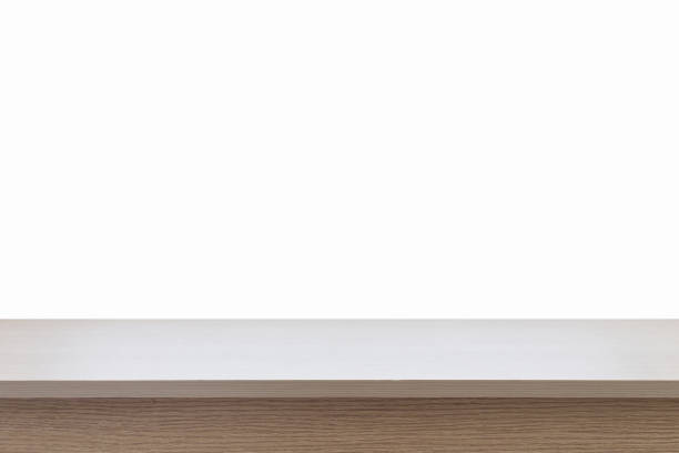 istock Empty top of wooden table or counter isolated on white background 919581082