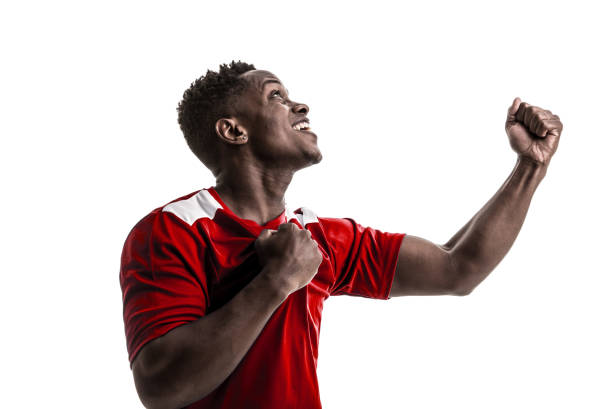 istock Fan / Sport Player on red uniform celebrating on white background 919608174