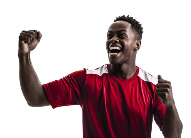 istock Fan / Sport Player on red uniform celebrating on white background 919608186
