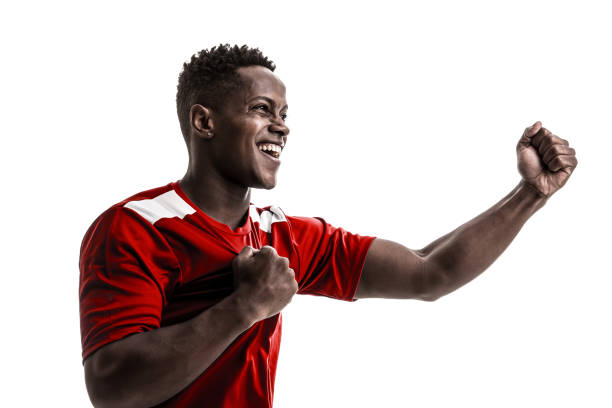 istock Fan / Sport Player on red uniform celebrating on white background 919608202