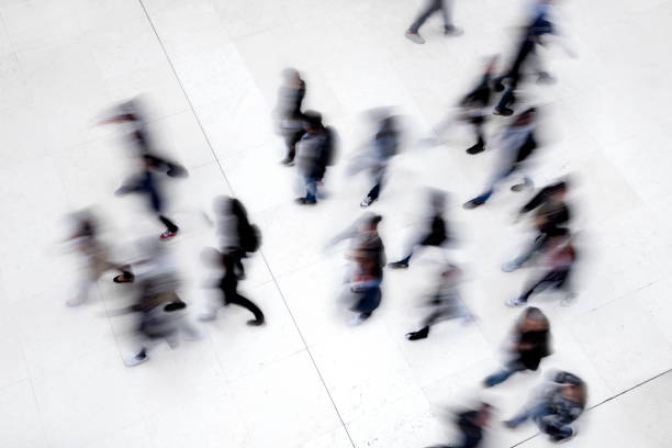 istock Large Group of Walking People 919608314