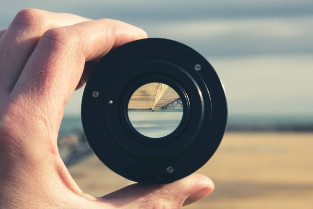 istock A concrete pier, the sea and the sky  through a camera lens - image inside is inverted, concept of summer vacation 919610628