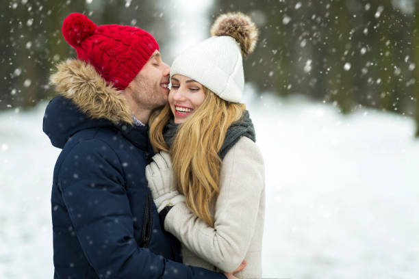 istock Couple in love in winter scenery 919617052