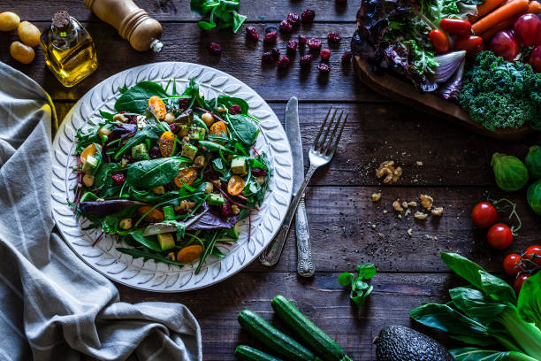 istock Healthy fresh salad plate on rustic wooden table 919632188