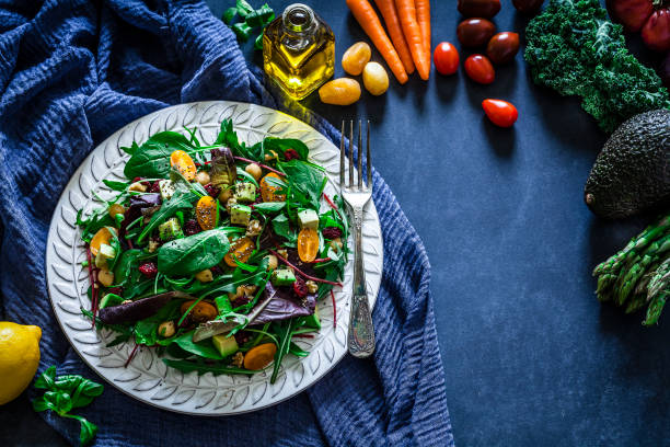 istock Healthy fresh salad plate on bluish tint table 919632196