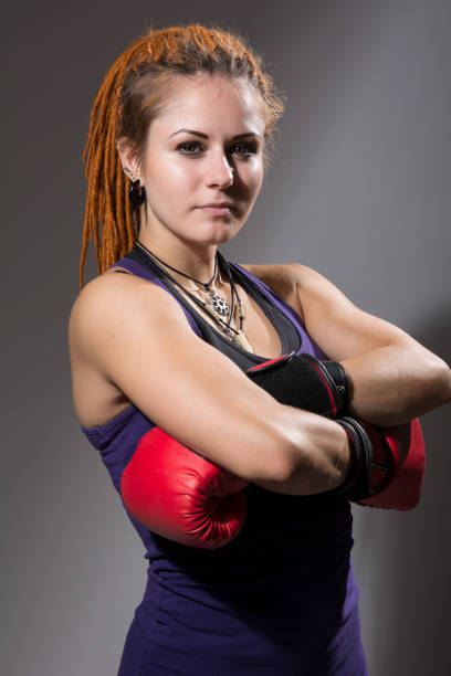 istock Young woman boxer with dreadlocks 919641036