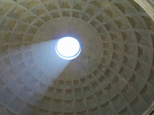 istock antheon dome as seen from inside the Pantheon with a visible light beam coming through the open hole. 919641254
