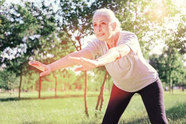 istock Concentrated elderly woman bending forward 919641794