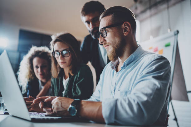 istock Concept of teamwork process at office.Coworkers meeting.Blurred background.Horizontal.Cropped. 919644492