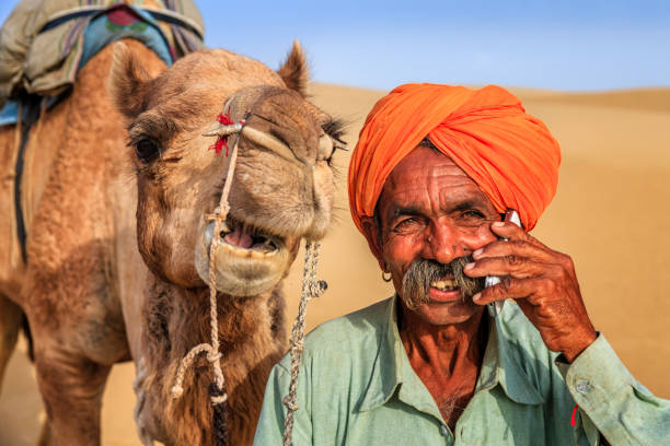 istock Indian man using a mobile, desert village, India 919644664