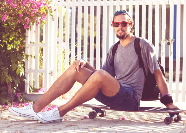 guy skateboard at sunset from his garden penthouse