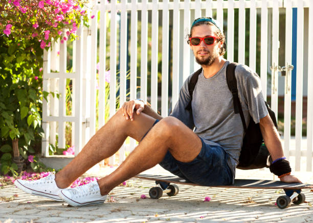 istock guy skateboard at sunset from his garden penthouse 919645142