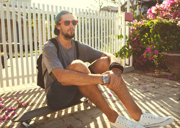 istock guy skateboard at sunset from his garden penthouse 919652434