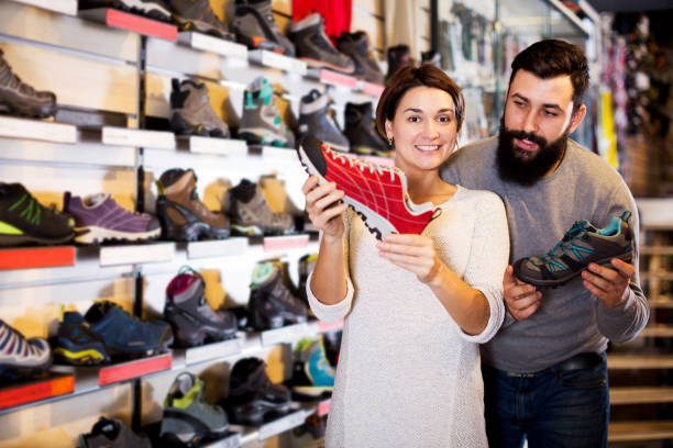 istock Couple deciding on new sneakers 919658972