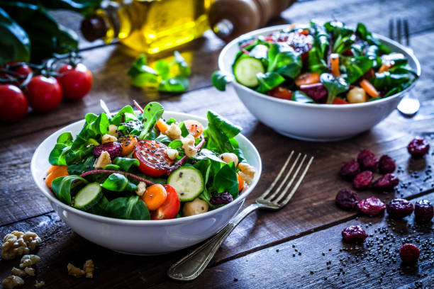 two fresh salad bowls - vegetables table imagens e fotografias de stock