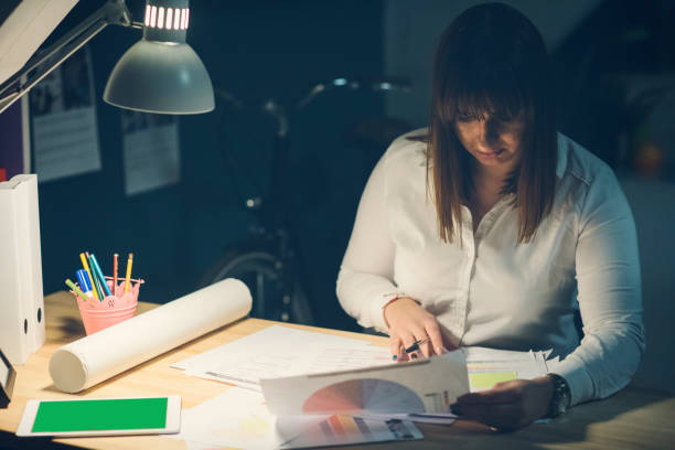 istock Businesswoman Working Late 919666286