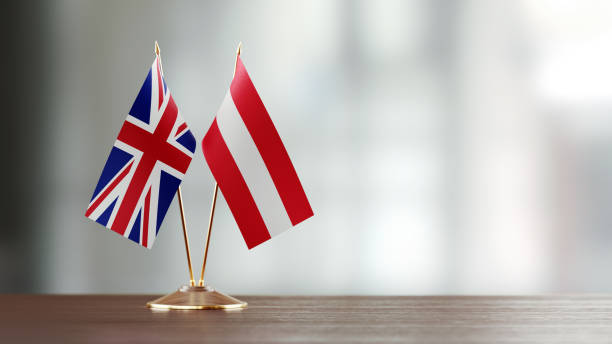 istock British And Austrian Flag Pair On A Desk Over Defocused Background 919667472