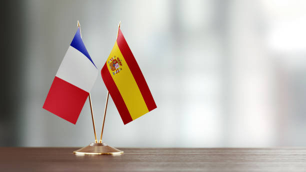 istock French And Spanish Flag Pair On A Desk Over Defocused Background 919680072