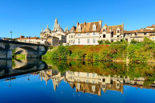 View from the historic village Perigueux with old bridge and famous Saint-Front Cathedral in the Dordogne region of southwestern France. The cathedral of Saint-Front was built about 1120–1173