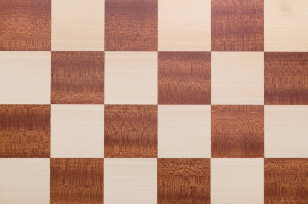 istock Chessboard texture top view. Checkered wooden background 919717084