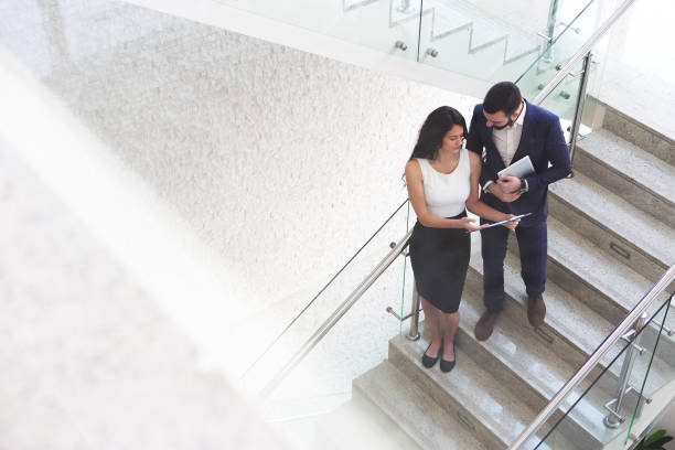 istock Top view of two business colleagues that talk about work outside office. 919721010
