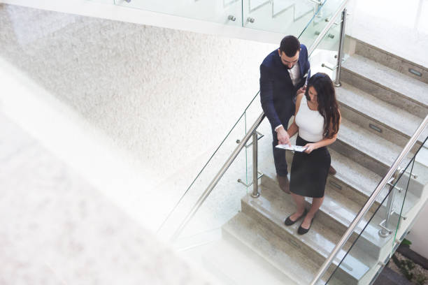 istock Top view of two business colleagues that talk about work outside office. 919721218