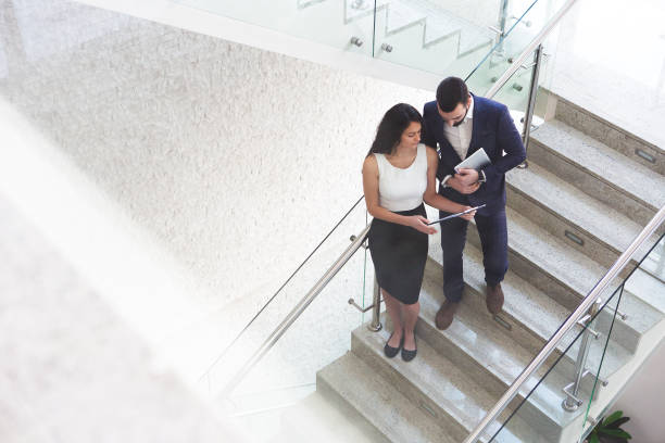 istock Top view of two business colleagues that talk about work outside office. 919721254