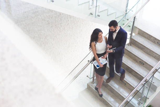 istock Top view of two business colleagues that talk about work outside office. 919721286