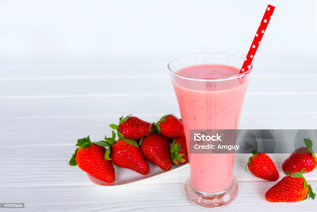Strawberry smoothies yogurt Strawberry smoothies yogurt, juice and strawberry  fruit for breakfast in the morning  on white wood. Berry Stock Photo