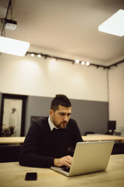istock Serious businessman working on laptop. 919739600
