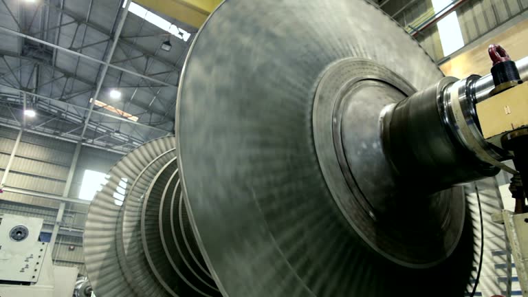 footage of spinning steam turbine at workshop