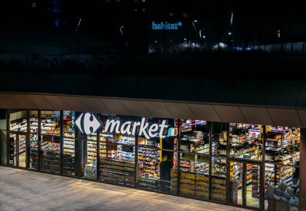 Retail giant, Carrefour supermaket, closed at night in the CityLife district of Milan, Lombardy, Italy stock photo
