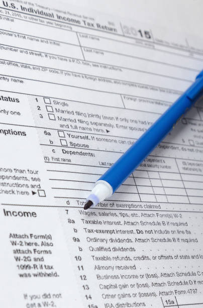 istock Close up of a pen and Form 1040 919743160