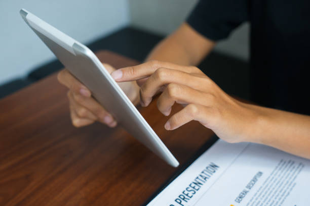 istock Close-up of female hands networking on touchpad 919759864