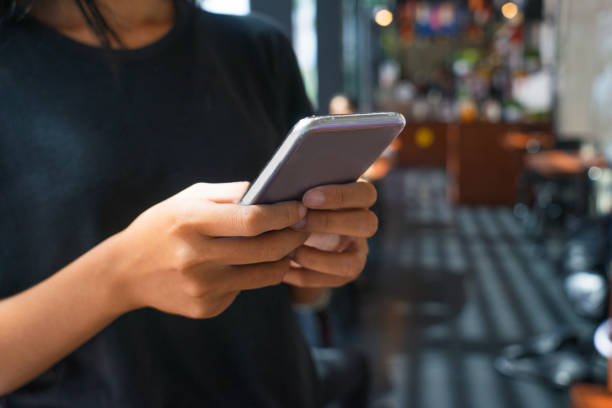 istock Close-up of hands texting message on smartphone 919759878