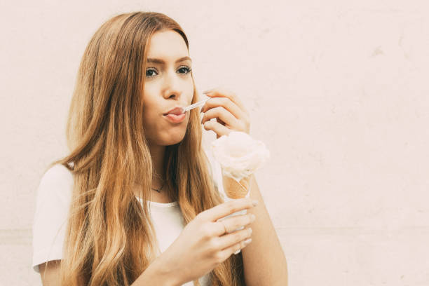 istock Enjoyable redhead tourist eating summer dessert 919762610