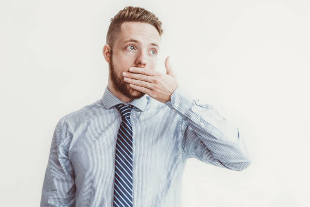 istock Surprised Young Business Man Covering Mouth 919768982