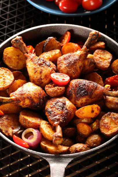 istock Roasted chicken legs with baked potato 919769186