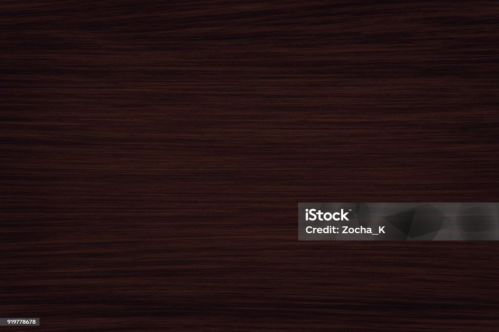 Horizontaly textured dark wood Fine natural dark wood background. A wood grain pattern featuring even grains of wood running horizontally across the image. The panel is new, clean and without damages. Wood - Material Stock Photo