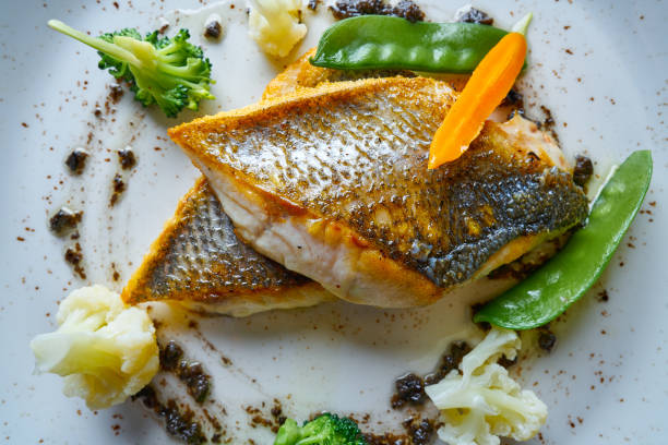 Seabass sea bass with stir fried vegetables Seabass sea bass with stir fried vegetables recipe sea bass stock pictures, royalty-free photos & images