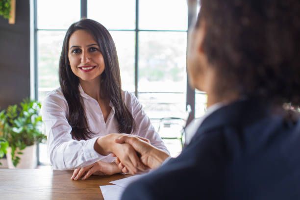 istock Happy business lady signing contract with customer 919789032