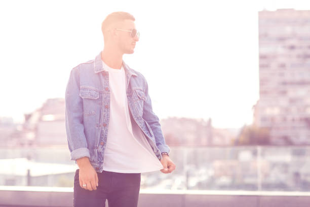 istock fashion guy posing in sunglasses on sunset 919789666