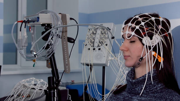 Female patient getting EEG exam Female patient getting EEG exam electrode stock pictures, royalty-free photos & images