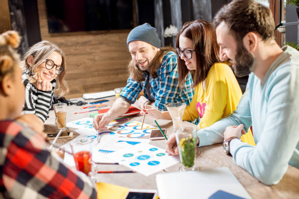 istock Group of people working together in the cafe 919793190