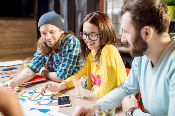 istock Group of people working together in the cafe 919793234