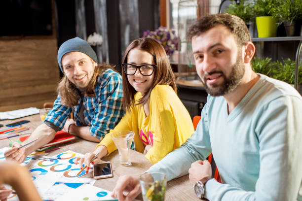 istock Group of people working together in the cafe 919793292