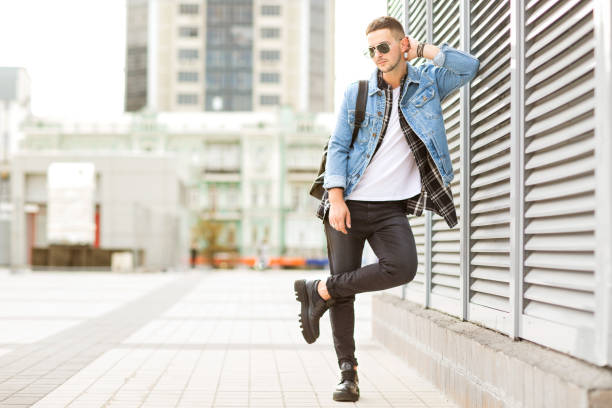 istock fashion guy posing in sunglasses on sunset 919800694